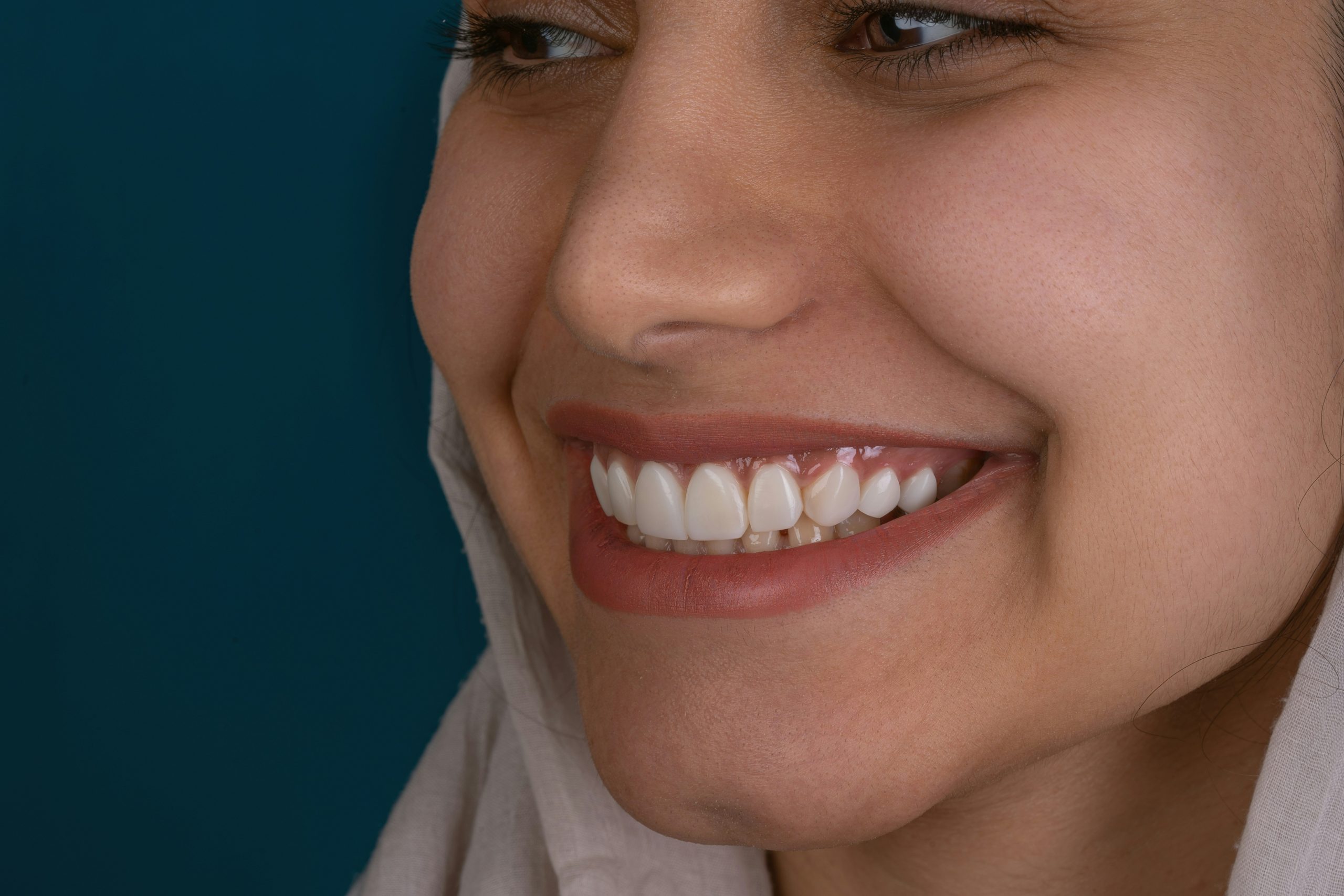 Photo illustration of happy user smiling while using laptop with caption 'Success!' overlayed