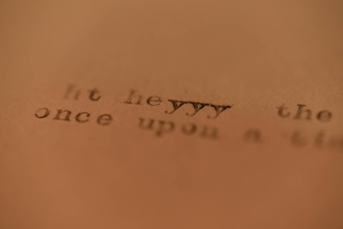 Illustration showing someone overwhelmed by writing captions on their laptop.